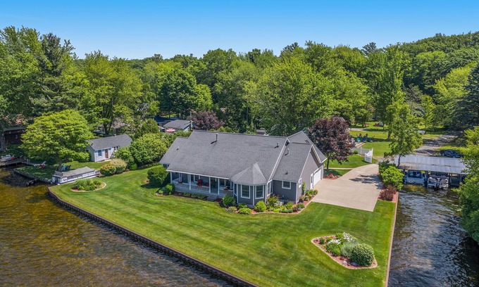 Ludington House | Private Hamlin Lake Water Front Cottage Perfect Family Retreat