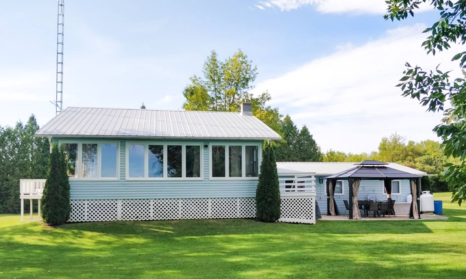 Front of Yonge Cottage | Private multi-family, fully stocked cottage on Graham Lake with large front lawn