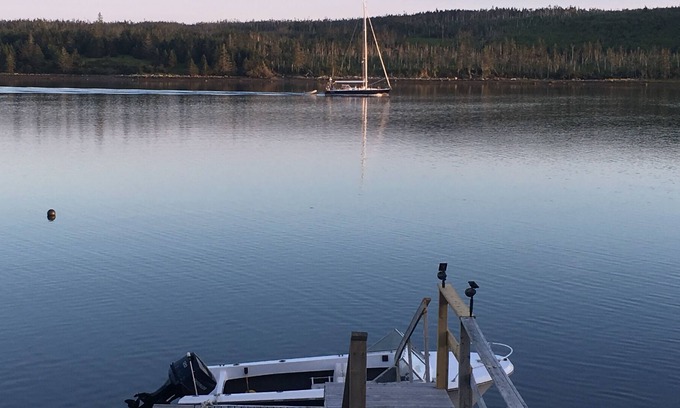 Liscomb Cottage | Private self contained cottage with terraced decking right to the water.