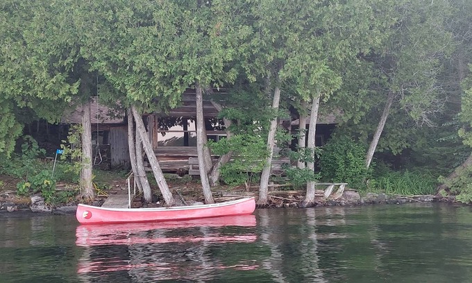 Limerick Cottage | Private water (boat) access, rustic offgrid log cabin on class five lake.