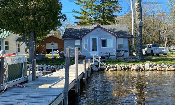 Carp Lake Cottage | Quaint Cottage with a Private Dock on Paradise Lake