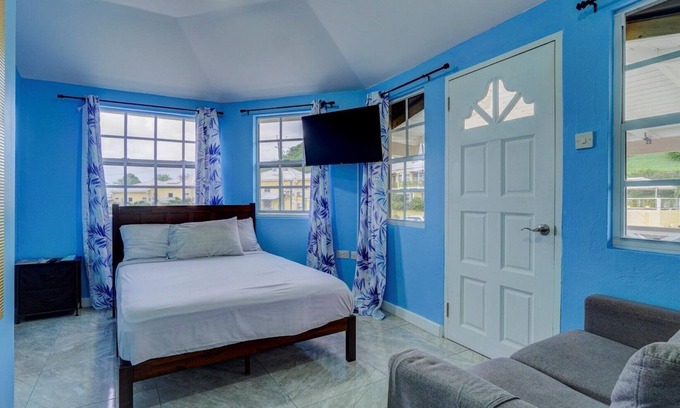 Calliste Apartment | Quaint one bedroom unit steps away from beach access
