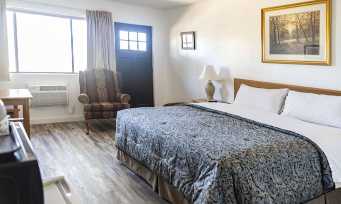Delta Hotel | Quaint Single King Hotel Room overlooking the Gunnison River and your Private Patio! Perfect for fishing and exploring the outdoors.