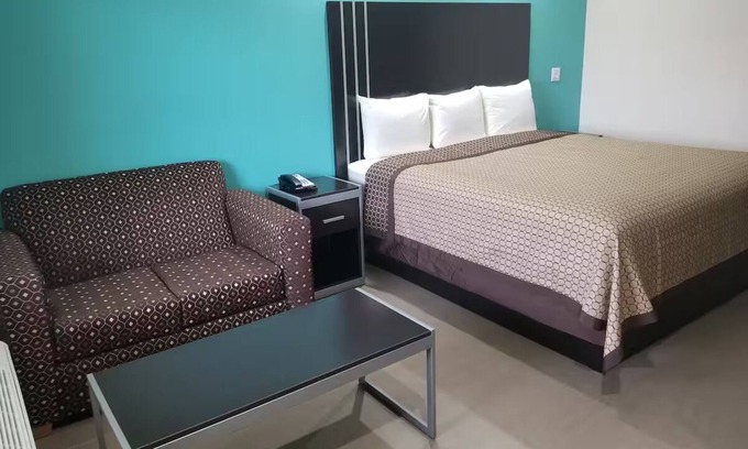 Bay City Hotel | Queen Bedroom with Kitchenette, Perfect for a Comfortable Stay in Bay City