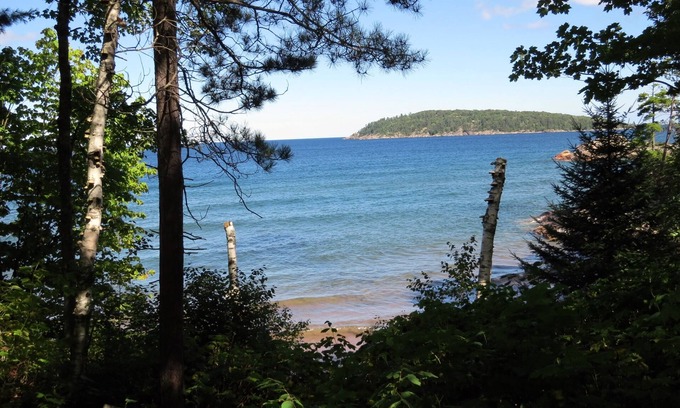 Marquette Apartment | Quiet, isolated oasis on 300 feet of Lake Superior beach and 10 wooded acres.