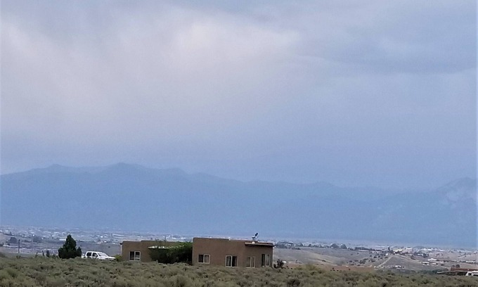 Taos House | Quiet, Pet Friendly Home with Mountain Views. Fenced area for dogs to roam