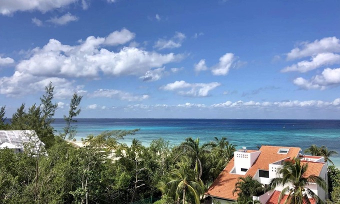 Colonia 10 De Abril Condo | Quiet PH in gated community with ocean views 1 minute walk from private beach