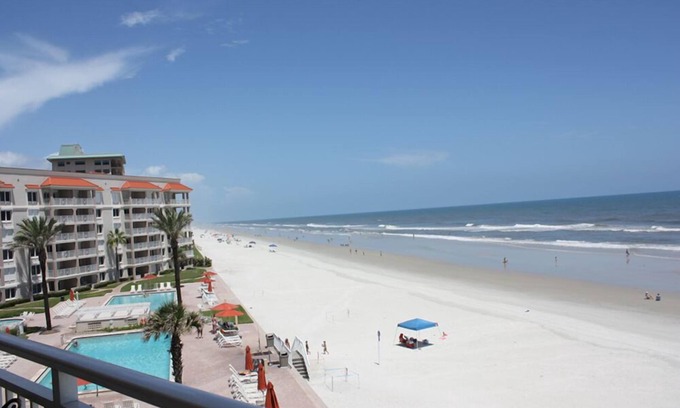 New Smyrna Beach Condo | Rare three bedroom end condo. Two bedrooms face the ocean with private balcony from Master bedroom.