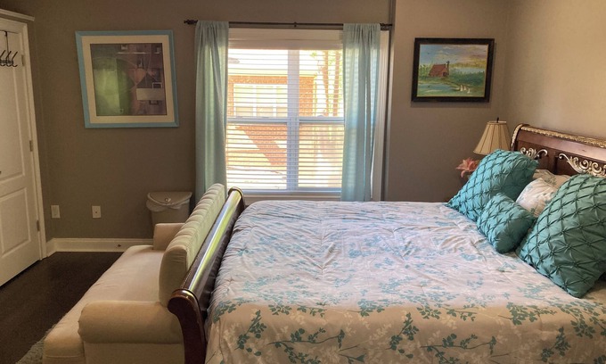 Braselton Apartment | Recharge here. One large bedroom within a furnished, terrace level apartment.