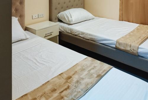 Pavia Hotel | RedDoorz @ Benelio Suites Pavia Iloilo