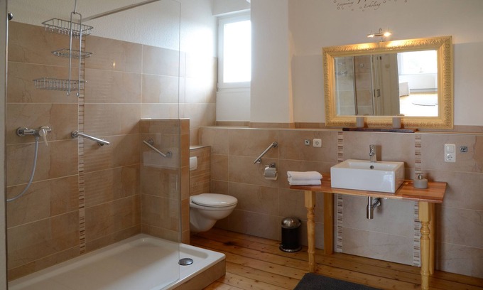 Cranz Apartment | Refurbished old building including tiled stove, double doors and direct water view