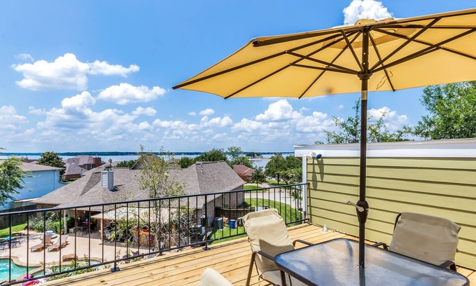 Seven Coves House | Relax and unwind on the deck with water view of Lake Conroe