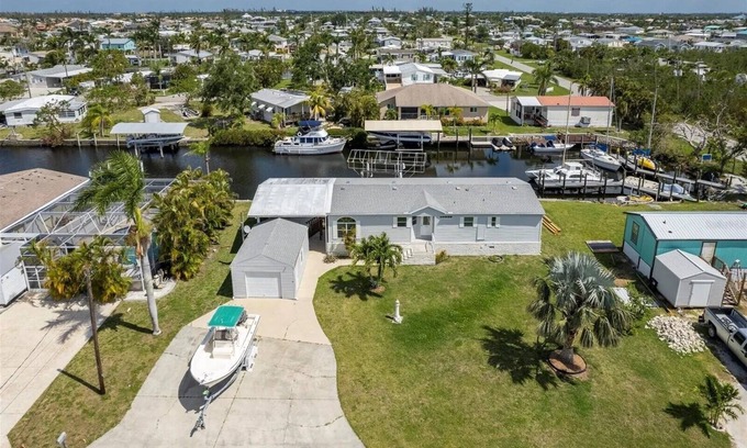 Charlotte Park House | Relax at 710 El Dorado Dr, canal waterfront property with private dock