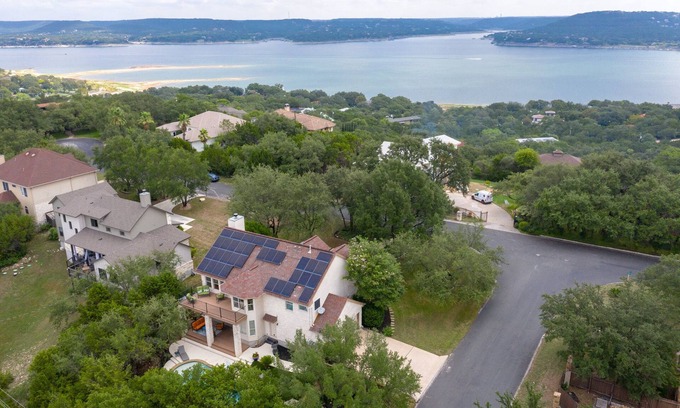 Travis Landing House | Relax in our beautiful backyard pool. Hop on Lake Travis at nearby marinas