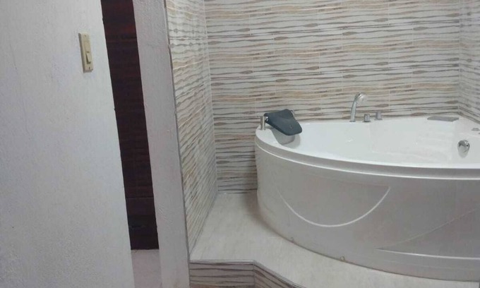 Spanish Town Zone House | Relax & Recharge in Spanish Town – 2BR Oasis w/Hot Tub, AC & Wi-Fi