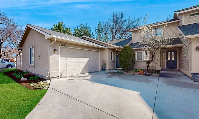 Southeast Boise House | Relaxing retreat with a gas fireplace, fenced yard, patio, & washer/dryer