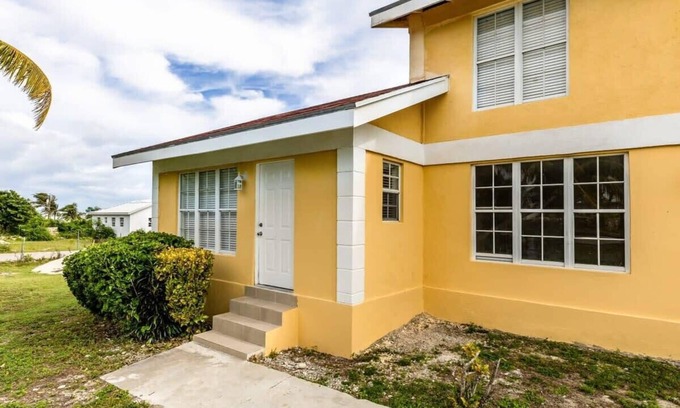 Bottle Creek Apartment | Relaxing Stay: Kitchen, Balcony & Beach Steps Away