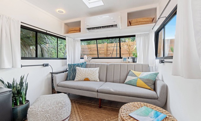 Navy Point House | Renovated 1970’s retro camper on Bayou Grande in Pensacola with walking trail.