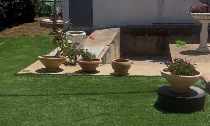 Qiryat Shemona Apartment | Renovated one room unit with a bomb shelter and a garden.