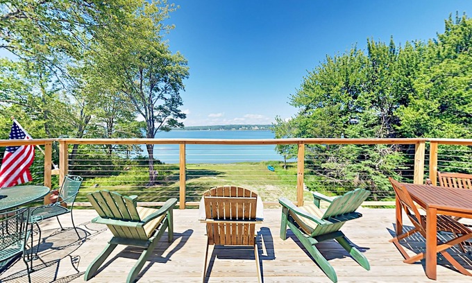 Lamoine Beach Cottage | Renovated waterfront cottage with expansive deck, multiple fireplaces, & grill