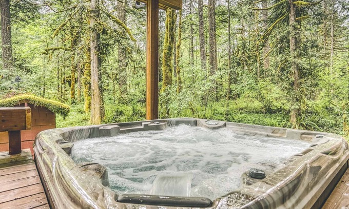 Welches Cabin | Ripplewood, a serene riverfront cabin, decks, hot tub, BBQ, dog-friendly
