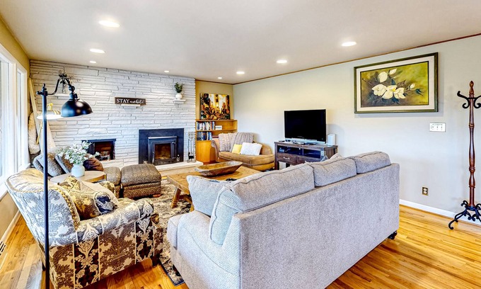 Spokane House | River-view home with yard, enclosed porch, wood stove, & private W/D