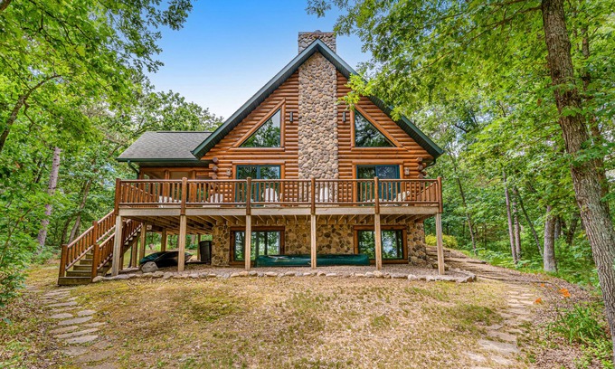 Lyndon Station Cabin | Riverfront cabin with a dock, kayaks and a canoe - firepit and water views