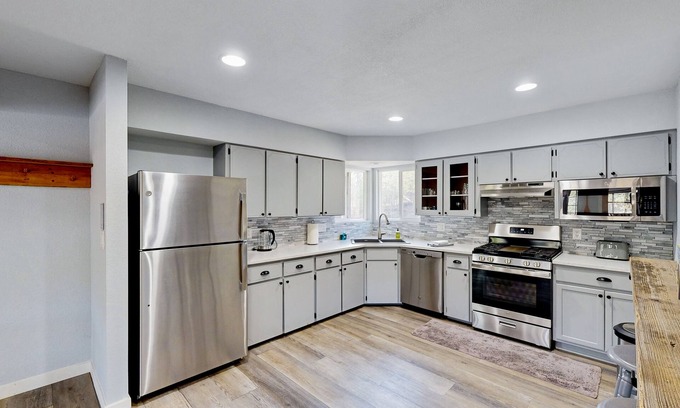 Post Falls House | Riverfront charmer with sunroom, gas grill, games, smart TVs, W/D, & partial AC