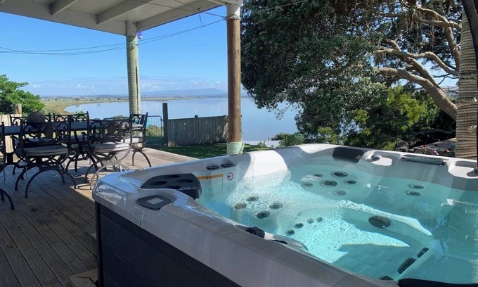 Te Kopuru House | Riverfront Family Home, with spa and stage