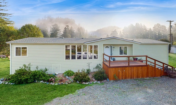 Crescent City House | Riverfront getaway with firepit, deck, fireplace, full kitchen, W/D, & WiFi