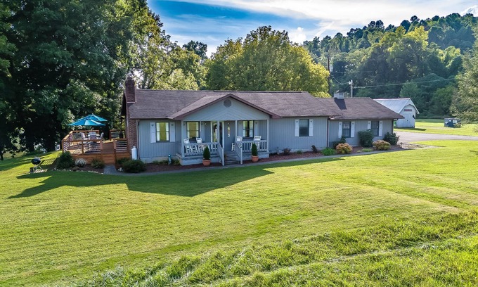Elizabethton House | Riverfront home with dock, mountain view, grill, firepit, smart TVs