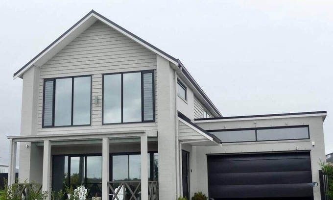 Karaka House | Riverfront Pet Friendly Minimalist Karaka Stay – Close to Motorway