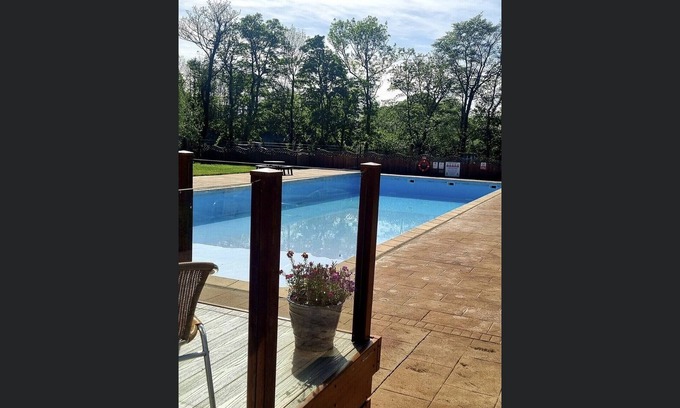 Bont Newydd Cabin | Riverside Cabin with Large Decking Area set in 120 acre Country Park, Snowdonia