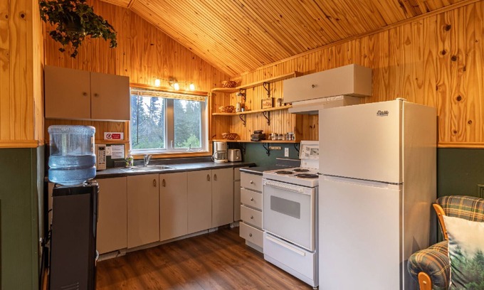 Lac-Etchemin Ski Chalet | Riverside chalet with fire pit, indoor fireplace, perfect for nature retreats.
