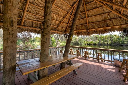Braden River Apartment | Riverside Luau Tiki Hut Fire Pit & Outdoor Fun