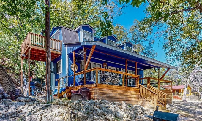 Bandera Cottage | Riverside Retreat with outside dining area, deck and internet