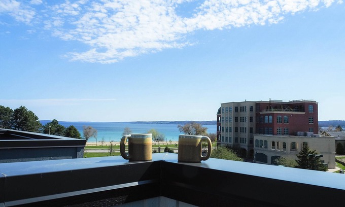 Traverse City Condo | Rooftop Views of West Bay & Downtown! Fantastic condo just steps away from beach