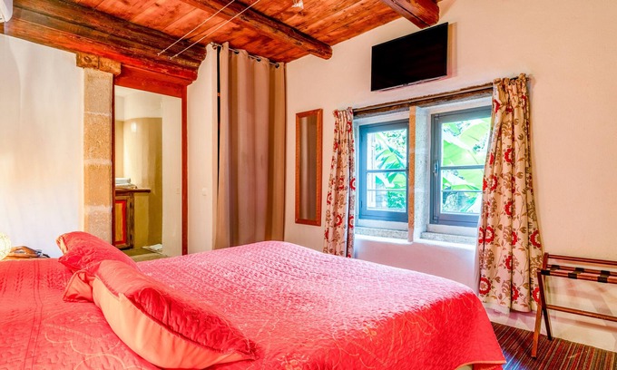 Collias Apartment | Room '12' with shared pool, Wi-Fi and air conditioning