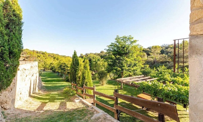 Hoz y Costean Cottage | Room with private bathroom and living room in a rural house