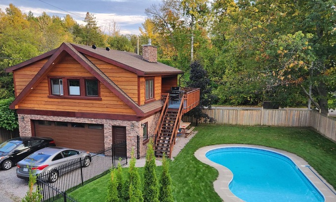 Barrie Ski Chalet | Rustic luxury chalet with pool, a two-minute walk to beach, park and playground!