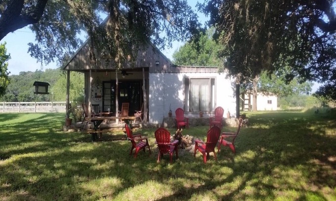 Uvalde Cabin | Rustic River Cabin under the Oaks and just a short walk to the river.