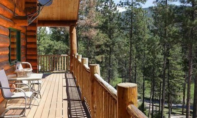 Greenough House | Rustic, spacious, log home nestled into the hillside of 2 acres near river access.