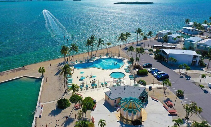 Cudjoe Key RV Rental | RV Lot 303 Venture Out, Pull-through Lot near the Ocean and Pool - Bring your golf cart!