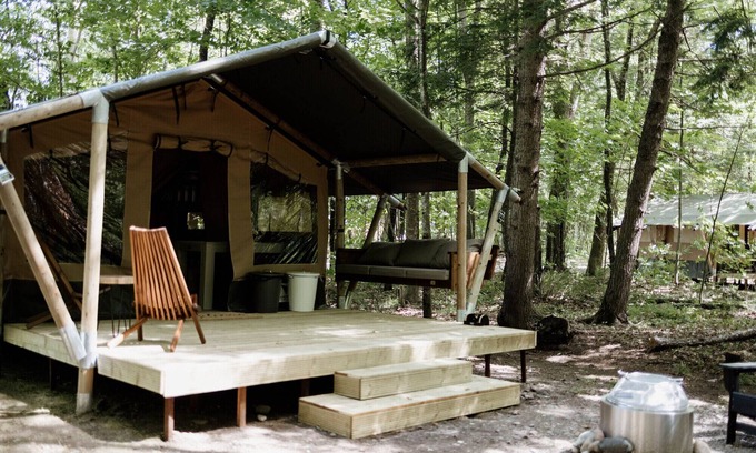 Woodstock RV Rental | Safari Tent Site 11 | 1 King Bed | Woods View
