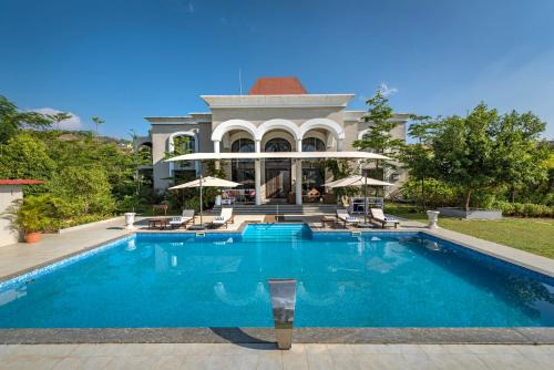 Kadadhe Villa | SaffronStays Zuma Villa, Pawna - luxury villa with a heated pool, sports court and gym