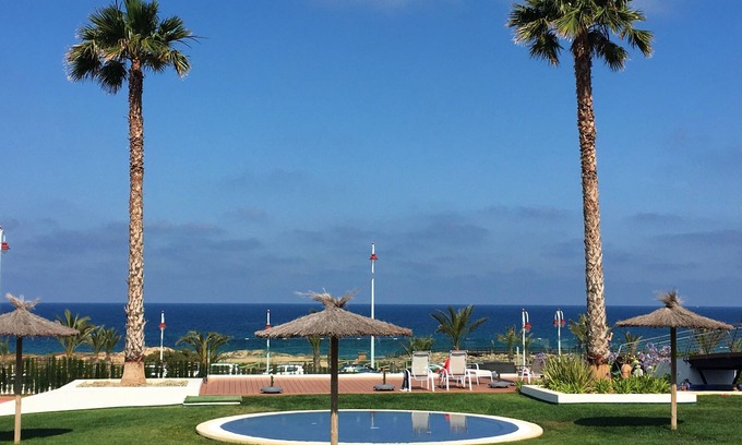 Els Arenals del Sol Apartment | Seafront apartment with terrace, garden and sea views