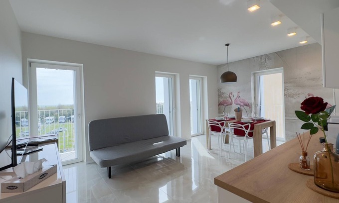 Chioggia Apartment | Seafront Modern Flamingo Suite by Ca-sa Check