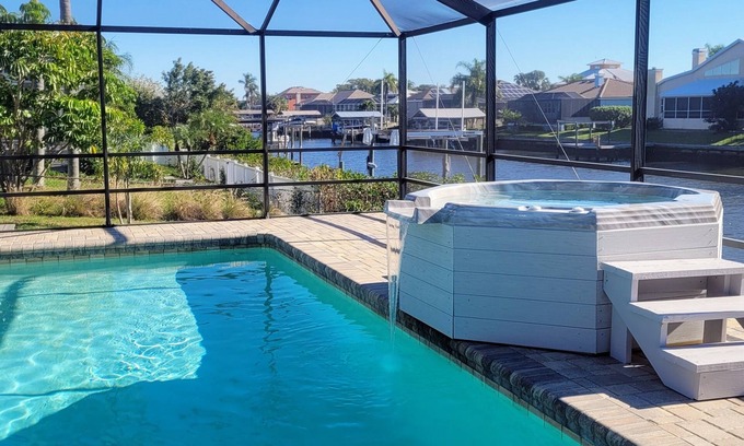 Apollo Beach House | Seaside Oasis! Dog-Friendly, Waterfront, Private Dock, Saltwater Pool & Spa,