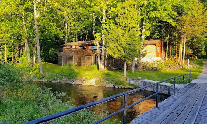 Mayfield Cottage | Secluded Cottage on the Boardman River w/Hot Tub & Fireplace