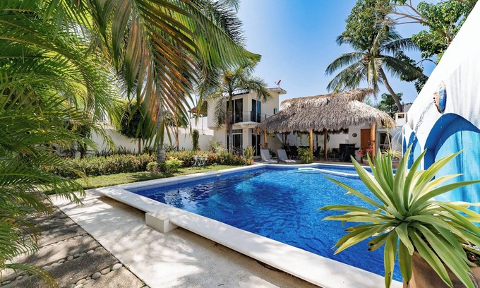 Crucecita Villa | Serene Escape with Pool Surrounded by Lush Gardens